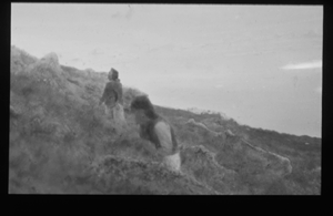 Image of Two White men on mossy hill